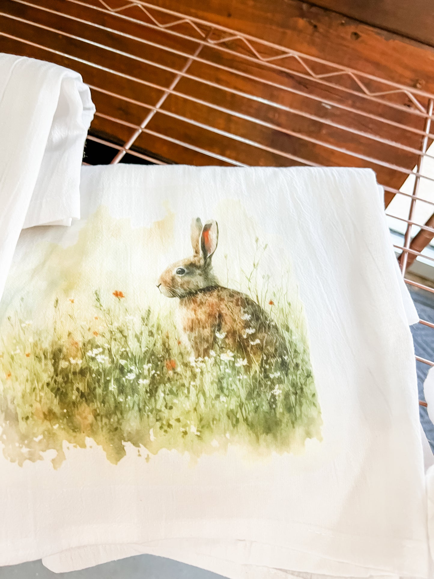 Bunny in wildflower field Kitchen Towel